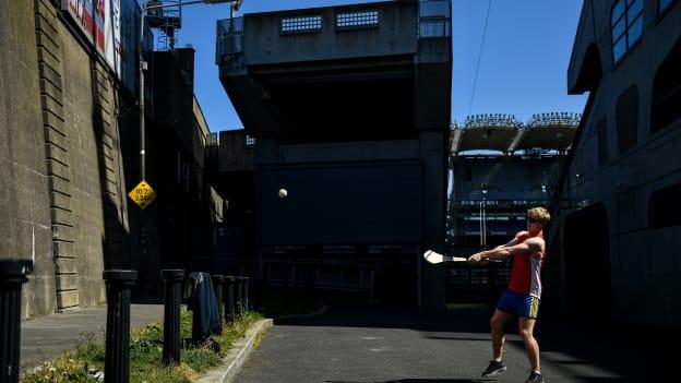 Paul Fennell, a member of the Castletown Geoghegan GAA club in Westmeath, pucs a sliotar against a wall outside Croke Park Stadium in May, 2020.