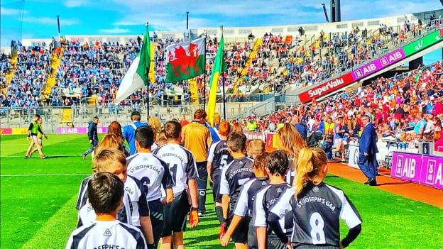 Players from St. Joseph's, Swansea, Juvenile GAA club parade around Croke Park before playing an exhibition match at half-time in the 2017 All-Ireland SFC quarter-final between Tyrone and Armagh. 