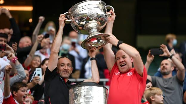 Tyrone joint-managers Brian Dooher, left, and Feargal Logan lift the Sam Maguire Cup following the GAA Football All-Ireland Senior Championship Final match between Mayo and Tyrone at Croke Park in Dublin. 