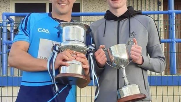 Longford Slashers senior team captain, Cian Kavanagh, and and U15 team captain, Darryl Swaris, photographed together with the Cups after their County Hurling Final wins on Sunday. 