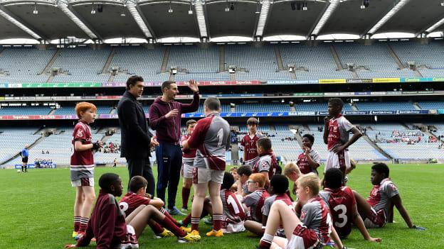 St Aidan's SNS, Brookfield players listen to their coach Mark Moloney, right, during the Corn Mhic Chaoilte Shield Final against St Cronan's SNS, Brackenstown, during day two of the 2019 Allianz Cumann na mBunscol Finals at Croke Park in Dublin. 