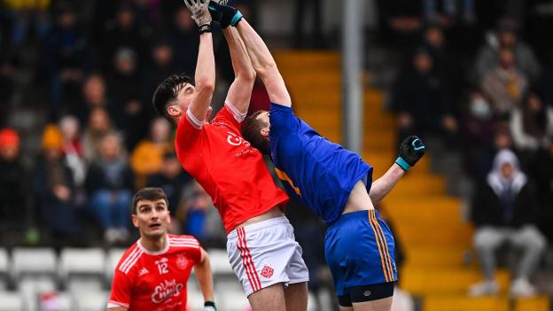 Mark McInerney of Eire Óg Ennis in action against Alan O'Connor of St Finbarr's during the AIB Munster GAA Football Senior Club Football Championship Semi-Final match between St. Finbarr's and Éire Óg Ennis at Pairc Ui Rinn in Cork.