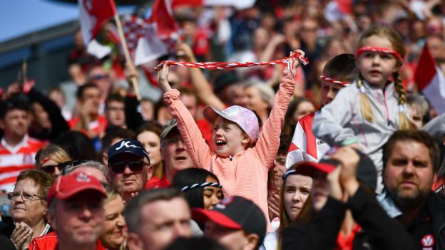 Derry supporters celebrate a score during the GAA Football All-Ireland Senior Championship Quarter-Final match between Clare and Derry at Croke Park, Dublin. 