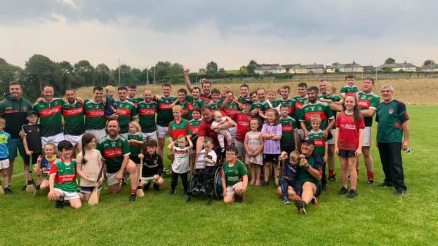 Inniskeen Grattans supporters celebrating with the players after  victory in the Cúchulainn Cup Final. 