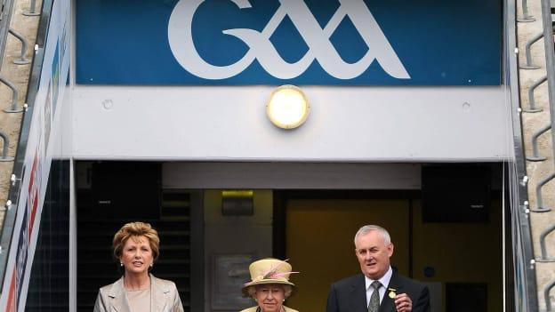 HM Queen Elizabeth II, centre, and President of Ireland Mary McAleese are escorted onto the Croke Park pitch by Uachtarán CLG Criostóir Ó Cuana in 2011. 