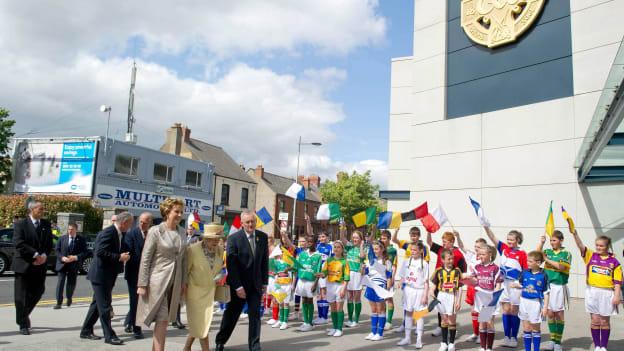 HM Queen Elizabeth II is greeted by President Mary McAleese and Uachtarán CLG Criostóir Ó Cuana as she arrives for their visit to Croke Park.