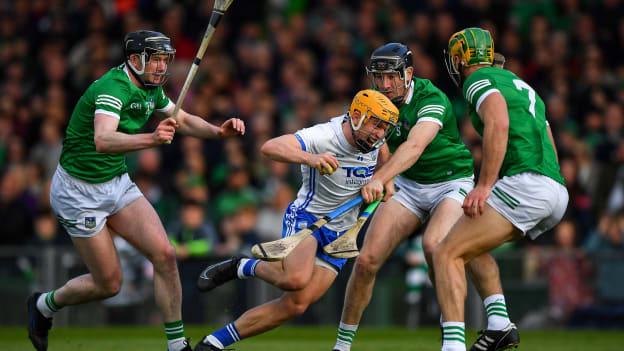 Jack Prendergast of Waterford is tackled by Limerick players Declan Hannon, Diarmaid Byrnes and Dan Morrisey during the 2022 Munster GAA Hurling Senior Championship Round 2 match between Limerick and Waterford at TUS Gaelic Grounds in Limerick. Photo by Ray McManus/Sportsfile
