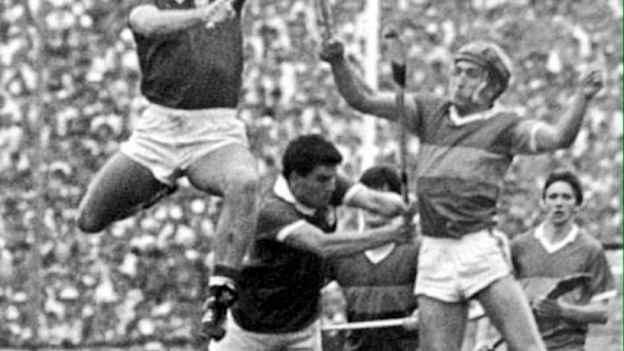 Teddy McCarthy contests a high ball with Tipperary's Colm Bonnar. 