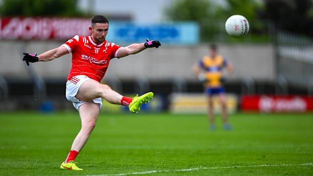 Ciaran Downey of Louth kicks a point. Photo by Shauna Clinton/Sportsfile