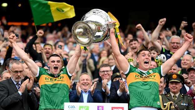 Seán O'Shea, left, and Joe O'Connor lift the Sam Maguire Cup jointly in 2022. Photo by Stephen McCarthy/Sportsfile