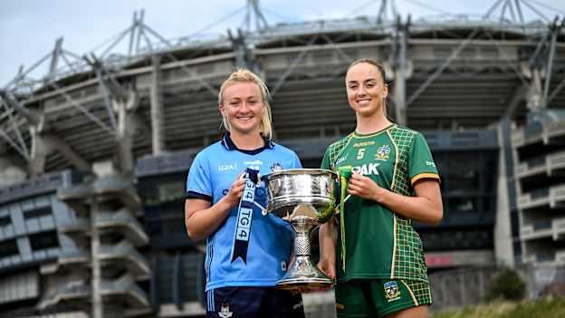 Dublin captain Carla Rowe, left, and Meath captain Aoibhín Cleary with the Brendan Martin Cup. Photo by Ramsey Cardy/Sportsfile