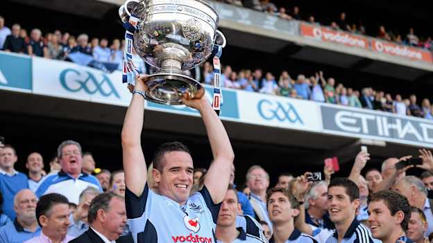 Ger Brennan lifts the Sam Maguire Cup for Dublin after victory over Mayo in 2013.