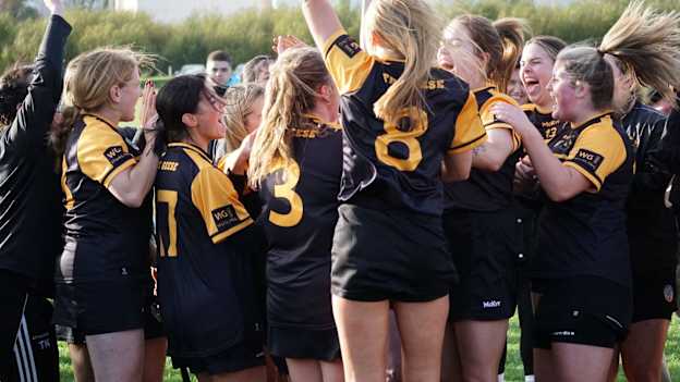The Wild Geese Junior Camogie team celebrate their 2024 Junior Championship success. 