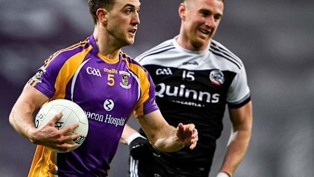 Kilcoo's Paul Devlin chases down Kilmacud Crokes' Andrew McGowan during the 2022 AIB All-Ireland club SFC final. Photo by Piaras Ó Mídheach/Sportsfile