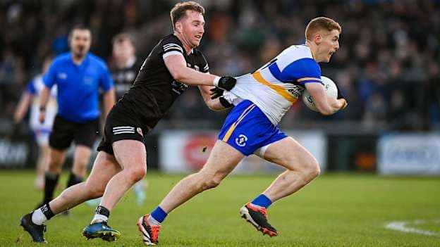 Paul Devlin gets to grips with Errigal Ciaran's Peter Harte in the 2024 AIB Ulster club SFC final. Photo by Ramsey Cardy/Sportsfile