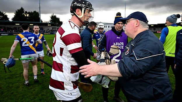 Loughrea manager Tommy Kelly, right, shakes hands with Brendan Rogers of Sleacht Neill. Photo by Seb Daly/Sportsfile