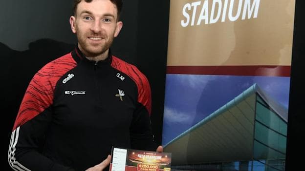 Louth football star, Sam Mulroy, pictured with a ticket for the Field of Fortune draw which can be purchased for €50 each. 
