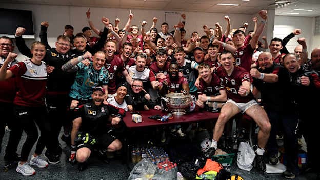 Westmeath players and officials celebrate with the Delaney Cup after capturing the Leinster SFC title. Photo by Ray McManus/Sportsfile