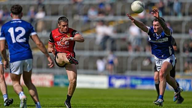 Pat Havern of Down scores a point against Pa Kirwan of Laois during the Tailteann Cup quarter-final match between Laois and Down at Laois Hire O'Moore Park in Portlaoise, Laois. Photo by Mark Kavanagh/Sportsfile.