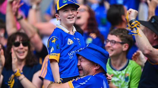 Wicklow supporter Mick Kelly, from Kiltegan, embraces his son Michael Anthony, age 10, at the final whistle after the Tailteann Cup final. Photo by Piaras Ó Mídheach/Sportsfile