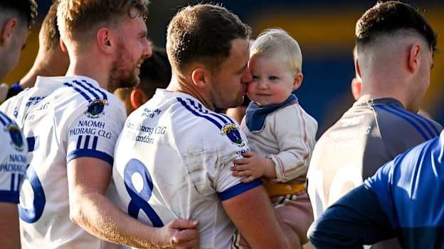Dean Healy of St Patrick's with his daughter Fíadh, aged 2, after a 2022 game in the Wicklow SFC. Photo by Piaras Ó Mídheach/Sportsfile