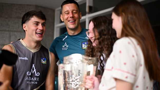Limerick hurlers Adam English, left, and Dan Morrissey with the Liam MacCarthy Cup are joined by Alice Clarke, centre, and Meghan Taylor at the Children's Health Ireland, Crumlin in Dublin after Limerick won The Liam MacCarthy Cup at Croke Park on Sunday. Photo by Shauna Clinton/Sportsfile