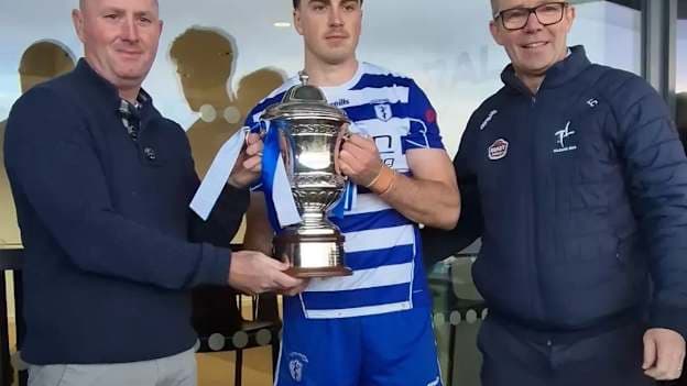 Conan Boran accepts the cup for Naas. Photograph courtesy of Kildare GAA.