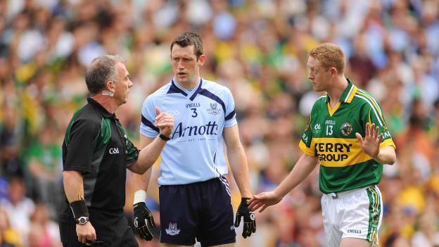Referee Pat McEnaney, Denis Bastick, and Colm Cooper during the 2009 All Ireland SFC Quarter Final.