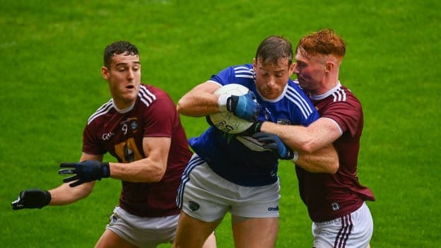 Kieran Lillis of Laois in action against Sam Duncan, left, and Ronan Wallace of Westmeath during the 2021 Leinster GAA Football Senior Championship Quarter-Final match between Laois and Westmeath at Bord Na Mona O'Connor Park in Tullamore, Offaly. Photo by Eóin Noonan/Sportsfile