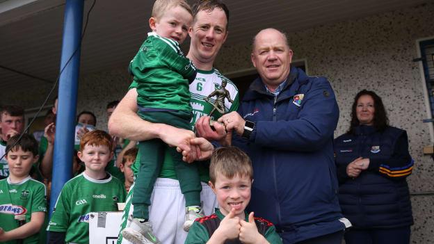 Clonguish centre-back, Joe O'Brien, receives his man of the match award.