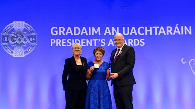 Breda Fitzgibbon of Skeheenarinky Hurling Club, Tipperary, is presented with the Munster Award by Maolmhuire Tynan, Head of Public Affairs AIB, and Uachtarán Chumann Lúthchleas Gael John Horan during the GAA President’s Awards at Croke Park in Dublin. 