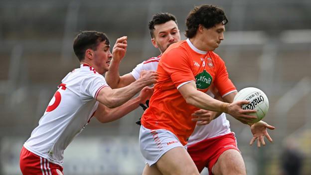 Armagh's James Morgan is tackled by Tyrone's Darragh Canavan and Conor McKenna at the Athletic Grounds.