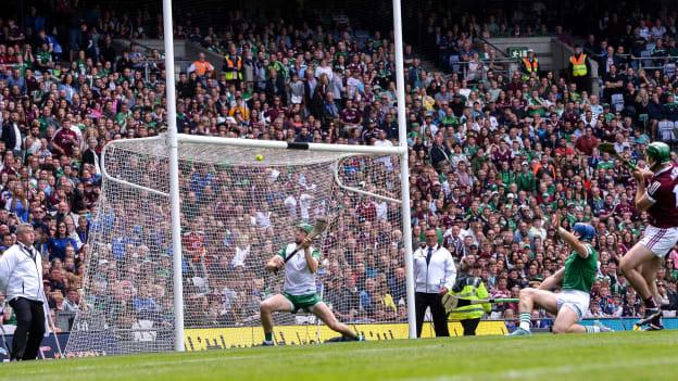 Nickie Quaid of Limerick is beaten by a shot by Brian Concannon of Galway, right, for Galway's first goal during the GAA Hurling All-Ireland Senior Championship Semi-Final match between Limerick and Galway at Croke Park in Dublin.
