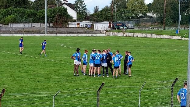 The St. Joseph's players receive some instruction from manager John Rouse. 