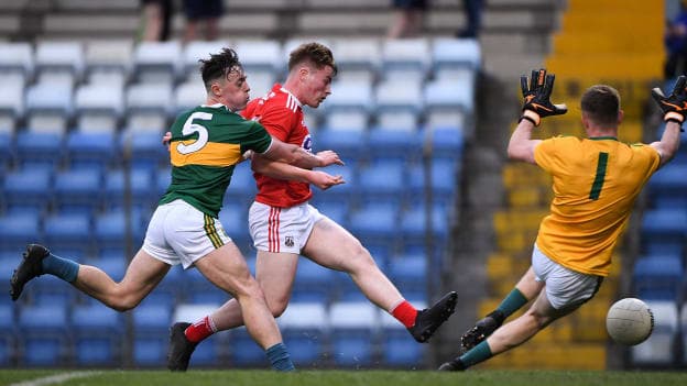 Fionn Herlihy of Cork scores the second goal past Kerry goalkeeper Brian Lonergan and defender Cian Gammell during the 2019 EirGrid Munster GAA Football U20 Championship Final match between Cork and Kerry at Páirc Ui Rinn in Cork. 
