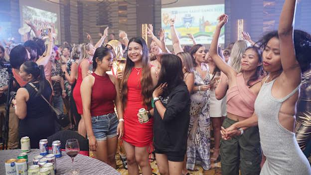 Cáirde Khmer players letting their hair down at the Asian Gaelic Games after party celebrations in 2022.