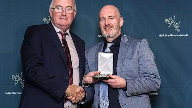 Iar-Uachtarán Chumann Lúthchleas Gael John Horan presents a MacNamee Awards for National Media for 2019 to Keith Duggan from the Irish Times.