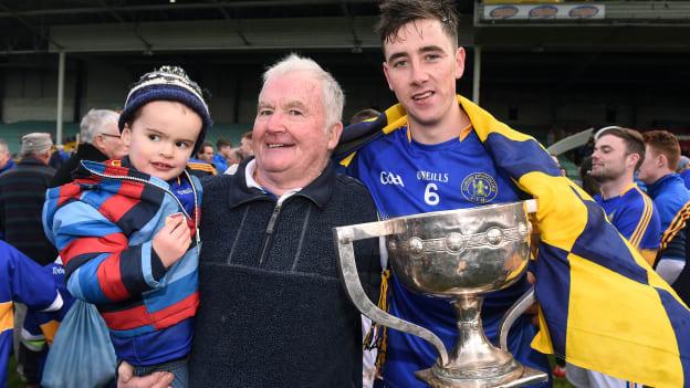 Richie Bennis (centre) celebrates Patrickswell's 2016 Limerick County SHC triumph with his grandson Riain Bennis and team captain Diarmaid Byrnes.