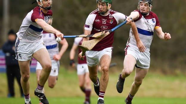 Brian Concannon of N.U.I. Galway in action against Conor Cleary, left, and Kevin O'Brien of University of Limerick during the Electric Ireland Fitzgibbon Cup Group A Round 2 match between N.U.I. Galway and University of Limerick at the National University of Ireland in Galway.
