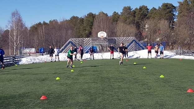 The Lulea Gaels players training on their improvised pitch. 
