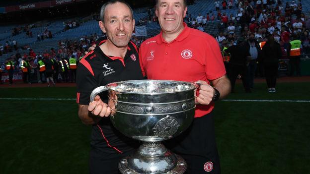 Tyrone joint-managers Brian Dooher, left, and Feargal Logan celebrate with the Sam Maguire cup after the GAA Football All-Ireland Senior Championship Final match between Mayo and Tyrone at Croke Park in Dublin. 