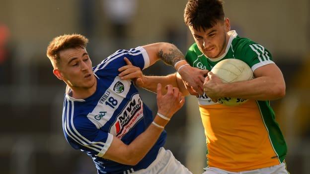 Eoin Carroll of Offaly is tackled by Trevor Collins of Laois during the GAA Football All-Ireland Senior Championship Round 3 match between Laois and Offaly at O'Moore Park in Portlaoise, Laois. 