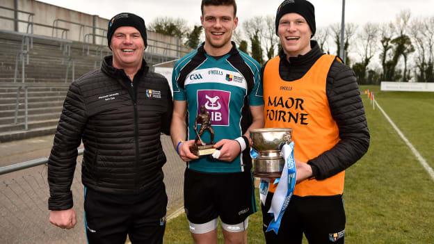 Electric Ireland Man of the Match Brian Hogan from Maynooth University with his father and manager Ken Hogan and his coach and brother Cian Hogan celebrate with the cup after victory over Ulster University in the 2018 Electric Ireland HE GAA Ryan Cup Final in Mallow, Cork. 