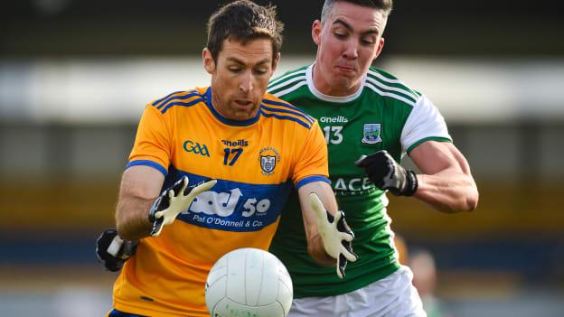 Gary Brennan, Clare, and Stephen McGullion, Fermanagh, in Allianz Football League action at Cusack Park.
