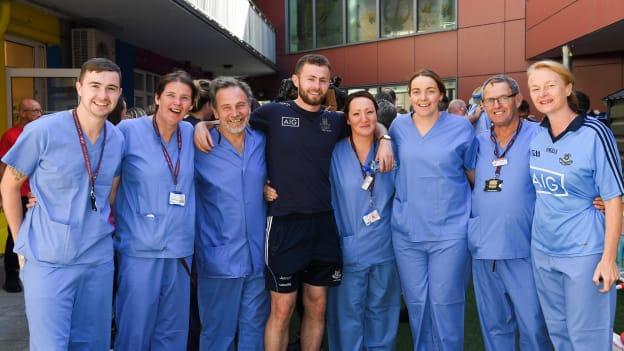 Dublin footballer Jack McCaffrey with nursing staff, from left, Jordan Kinsella, Annette O'Neill, Paul Behan, Caroline Kelly, Sarah Flaherty, Robert O'Byrne, and Paula Kelly during the All-Ireland Senior Football Champions visit to Our Lady's Children's Hospital, Crumlin in Dublin. 