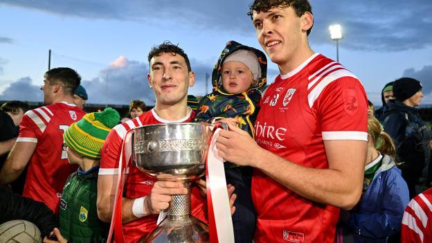 East Kerry captain Paudie Clifford, left, and brother David Clifford, and David's son Ogie, celerate with the Bishop Moynihan cup after the Kerry County Senior Football Championship final match between Mid Kerry and East Kerry at Austin Stack Park in Tralee, Kerry. Photo by Brendan Moran/Sportsfile.