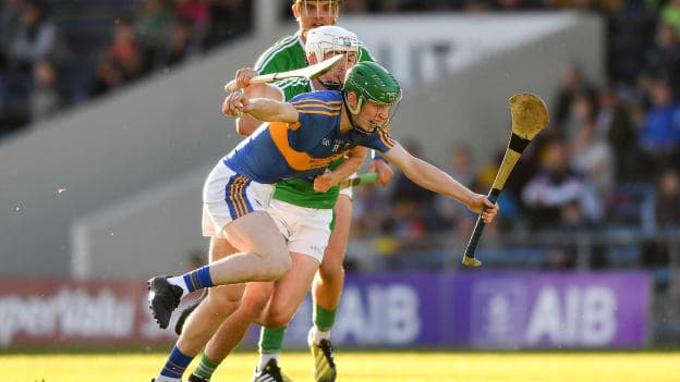 Paudie Feehan of Tipperary is tackled by Kyle Hayes of Limerick during the Bord Gais Energy Munster Under 21 Hurling Championship Semi-Final.