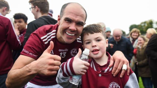 Paul Finlay of Ballybay, with his son, 9 year old, Aaron celebrate after the Monaghan County Senior Football Championship Final match between Scotstown and Ballybay Pearse Brothers at St Tiernach's Park in Clones, Monaghan. 