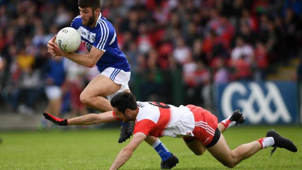 Daniel O'Reilly, Laois, and Chrissy McKaigue, Derry, during a 2019 All Ireland SFC Round Two Qualifier at Owenbeg.