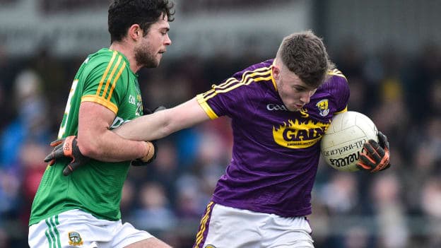 Niall Hughes, Wexford, and Ben Brennan, Meath, during the Bord Na Mona O'Byrne Cup clash in Enniscorthy.